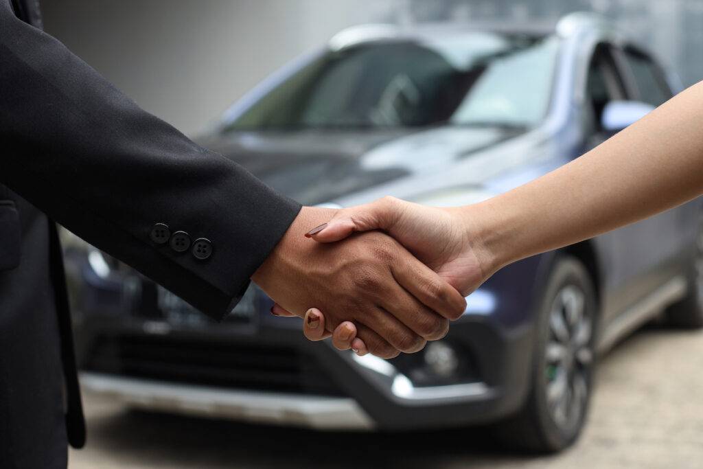 Car Sold Shaking Hands